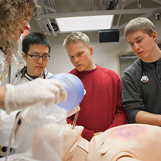 Medical student trainees attend a simulation session