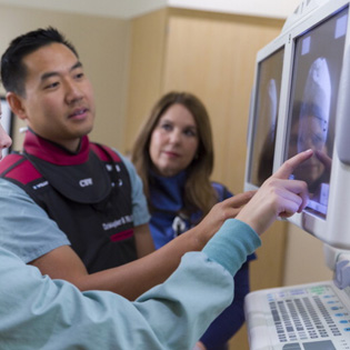 Anesthesiology residents work together on a case.