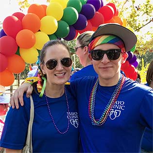 Christina Zorn, chief administrative officer and LGBTI MERG executive sponsor at Mayo Clinic's campus in Jacksonville, Florida, attends Jacksonville's River City Pride Parade with Andrew Austin, chair of the LGBTI MERG.