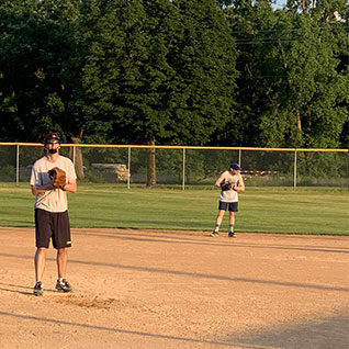 The neurosurgery resident and fellow softball team plays a game in Rochester, Minnesota.