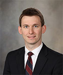 Brett Bezak, D.M.D., M.D.
