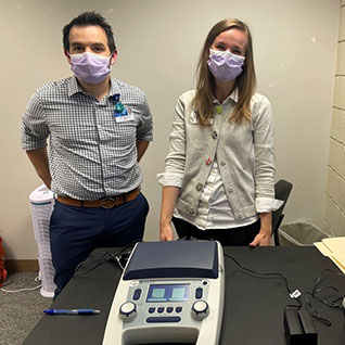 ENT residents with audiology equipment at Community Health Services Inc.