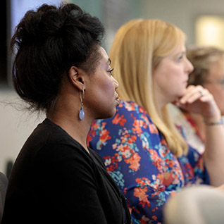 Mayo Clinic Alix School of Medicine student involved in the Health System Science dual degree option sitting in a meeting room.