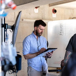 Mayo Clinic Alix School of Medicine student in the Mayo International Health Program (MIHP) looks at a chart.